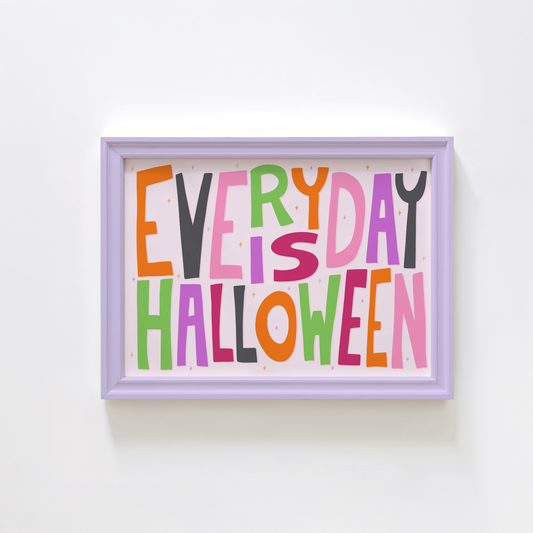A typographic wall art piece reading “EVERY DAY IS HALLOWEEN” in colourful letters.