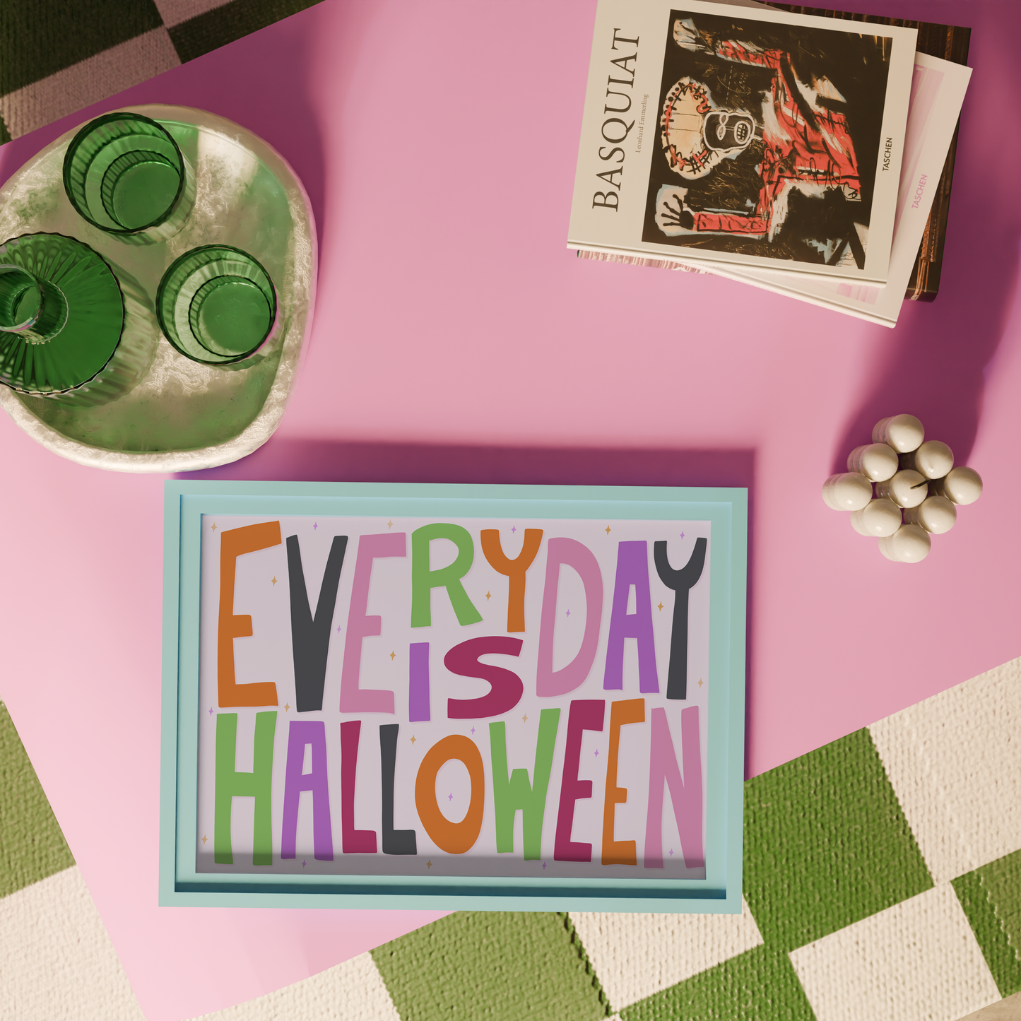 A typographic wall art piece reading “EVERY DAY IS HALLOWEEN” in colourful letters.