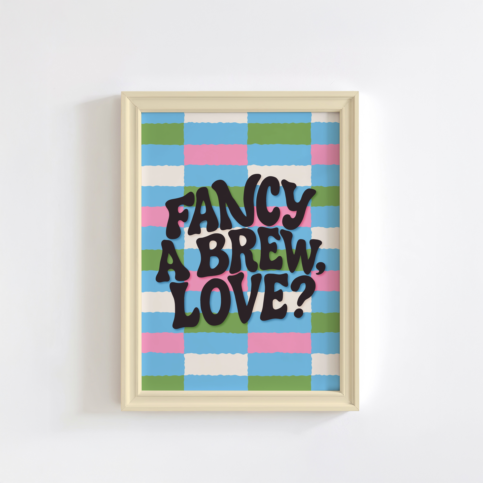 A brightly coloured print with a pink, blue, green and cream checkerboard pattern. In the centre of the print is a quote that reads 'fancy a brew, love?'.