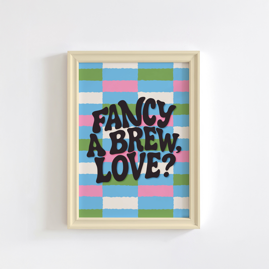 A brightly coloured print with a pink, blue, green and cream checkerboard pattern. In the centre of the print is a quote that reads 'fancy a brew, love?'.