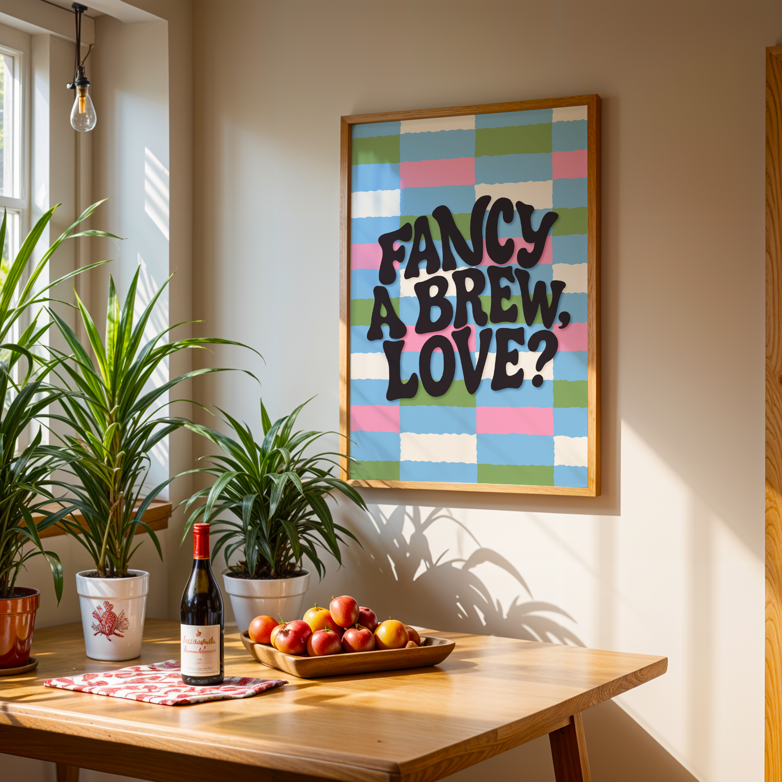 A brightly coloured print with a pink, blue, green and cream checkerboard pattern. In the centre of the print is a quote that reads 'fancy a brew, love?'.