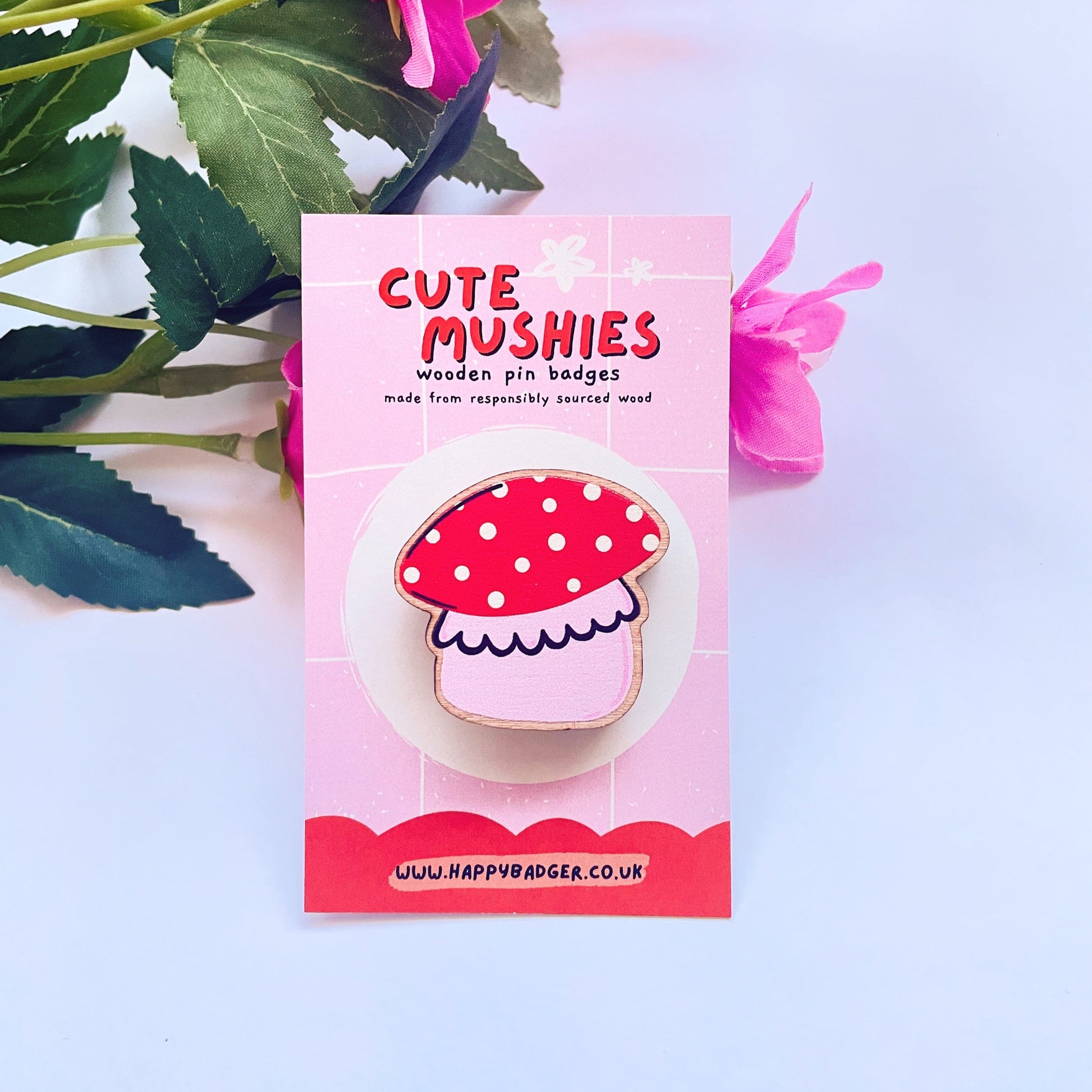 A wooden eco friendly pin badge of a cute chunky mushroom.