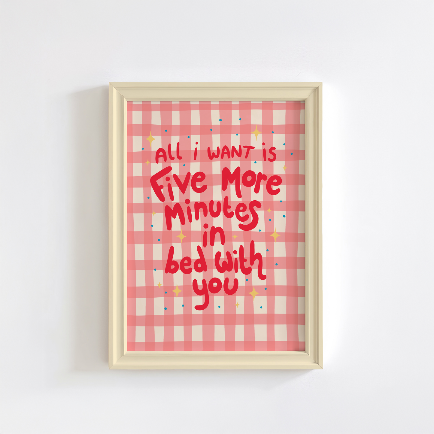 A pinky red checkered print with hand lettered text that says 'all I want is five more minutes in bed with you'.