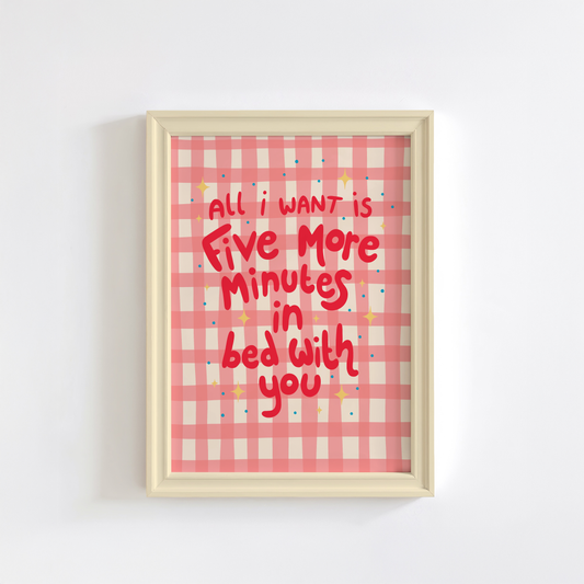 A pinky red checkered print with hand lettered text that says 'all I want is five more minutes in bed with you'.