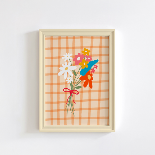 A framed art print featuring a hand-drawn bouquet of spring flowers in shades of white, pink, red, mustard, and teal on a cream and orange checkered background.