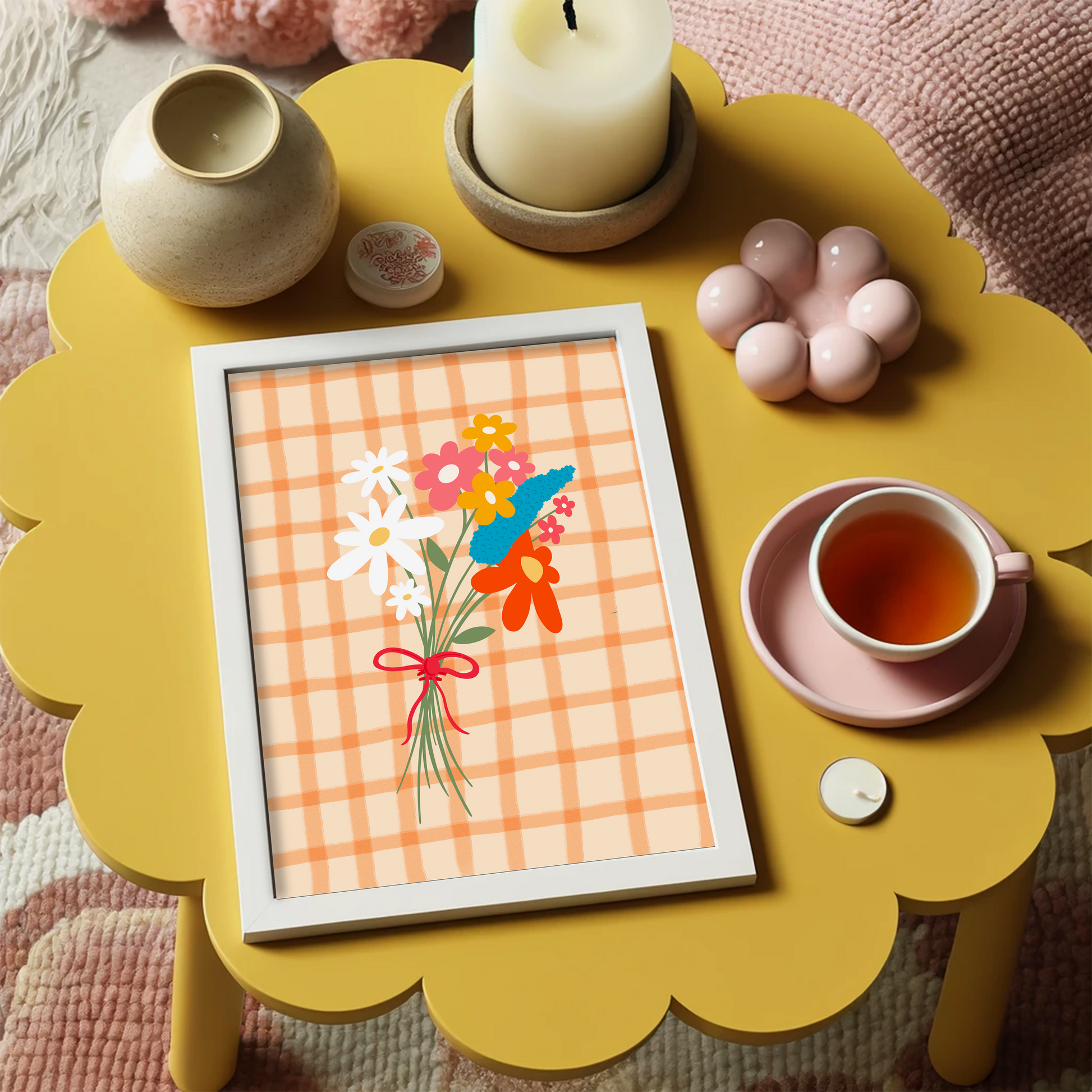 A framed art print featuring a hand-drawn bouquet of spring flowers in shades of white, pink, red, mustard, and teal on a cream and orange checkered background.