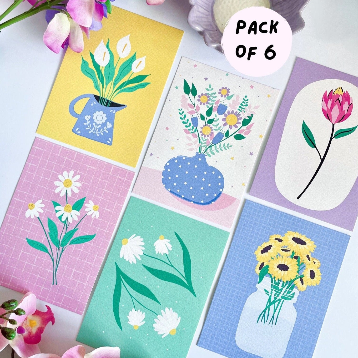 A pack of six floral illustrations postcards.