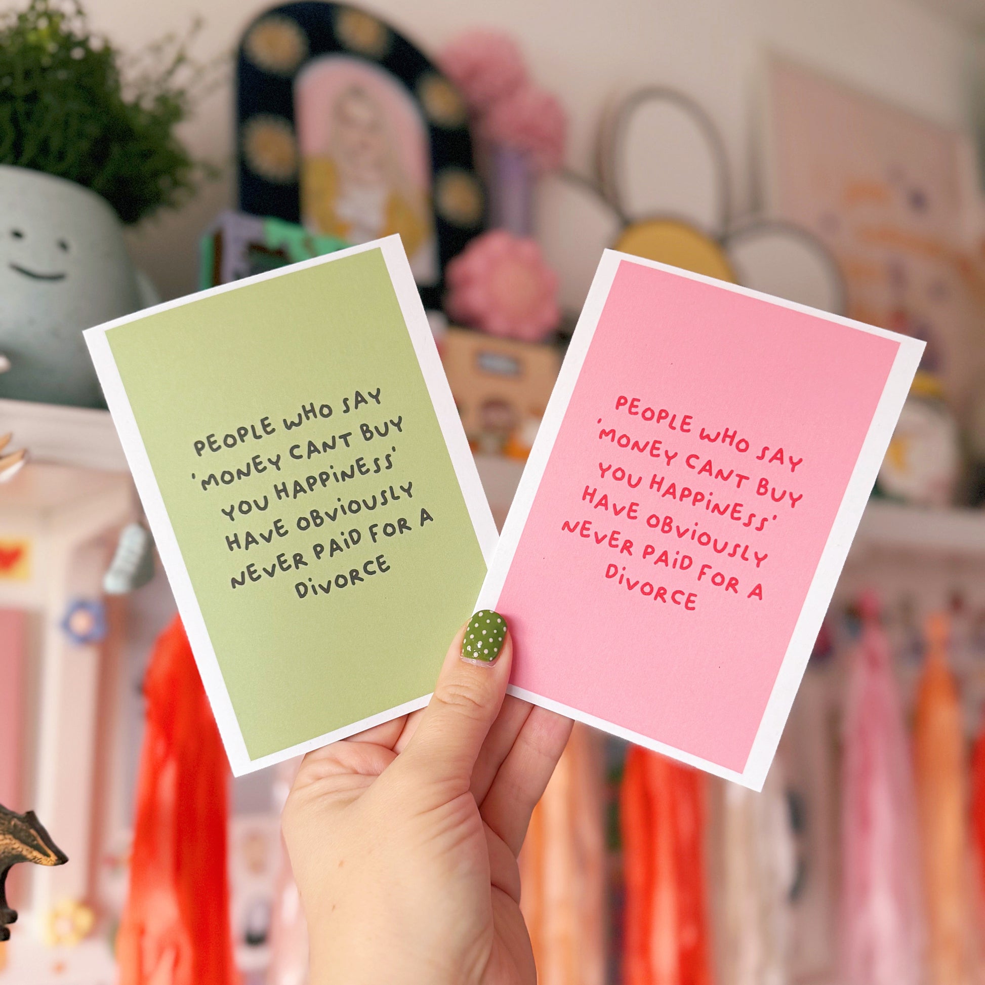 Two cards, one pink and one green, with a funny quote about divorce on the front.
