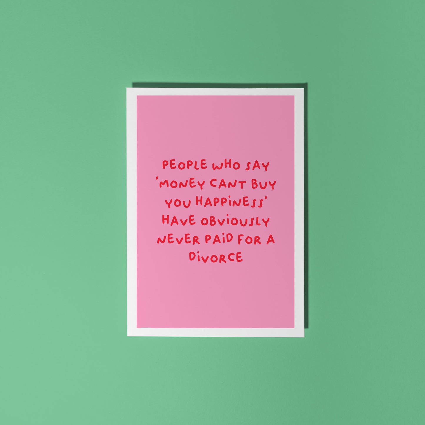 A pink card with a funny quote about divorce on the front.