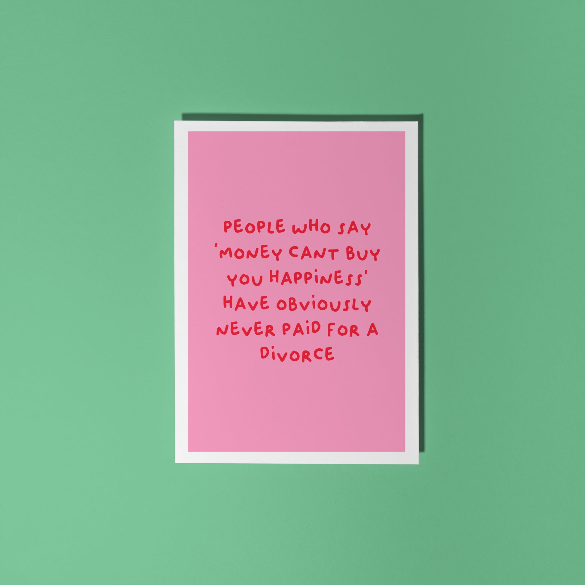 A pink card with a funny quote about divorce on the front.