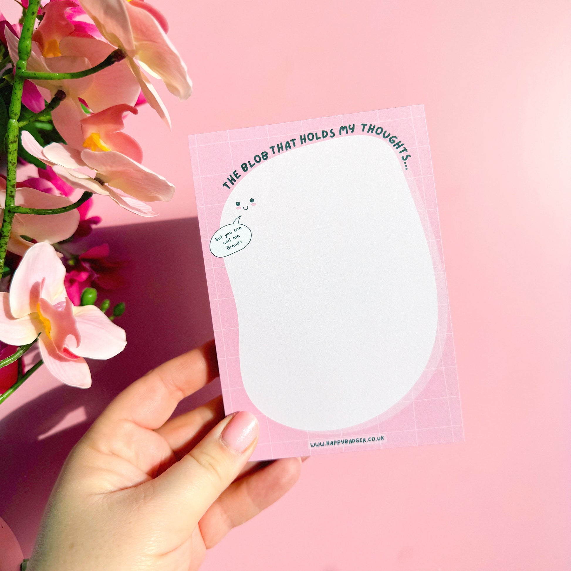 An image of Brenda, the blob that holds your thoughts. A pink 100 page notepad with a space for jotting down anything that's on your mind.