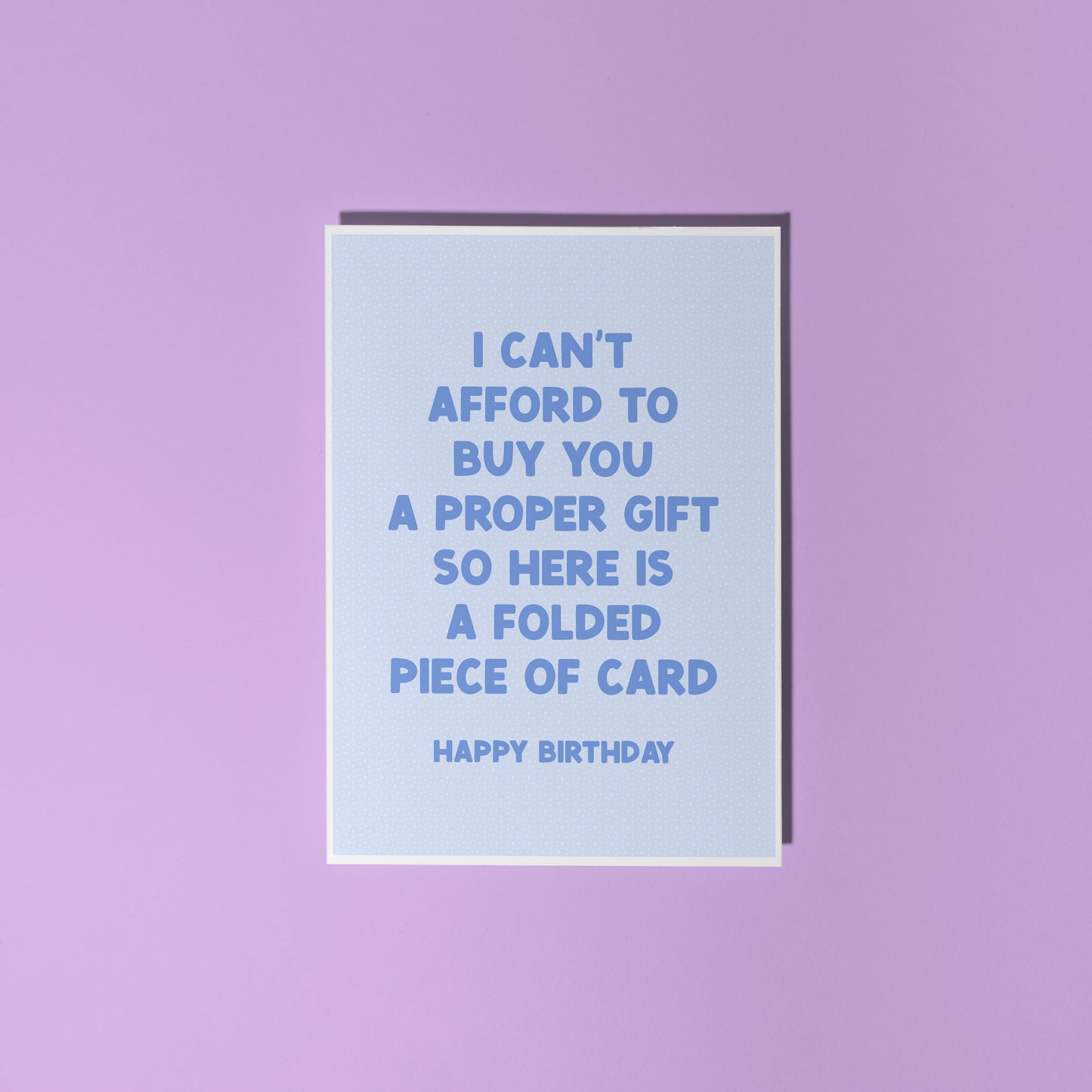Light blue card with humorous birthday message on a purple background