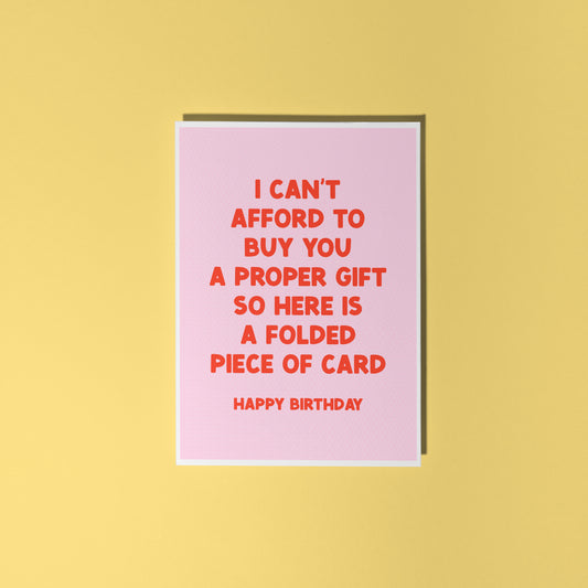 Pink card with red text on a yellow background