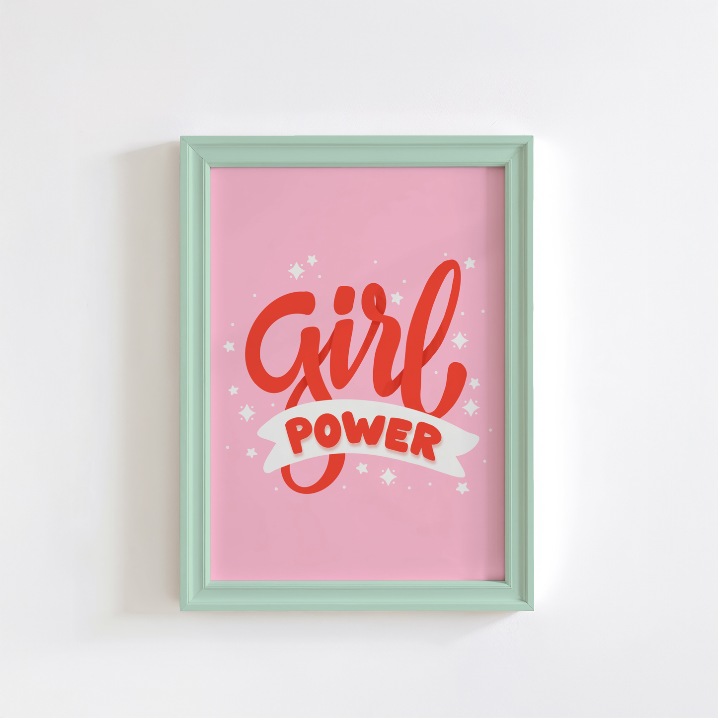 A quote print with the words 'Girl Power' in red text on a pink background.