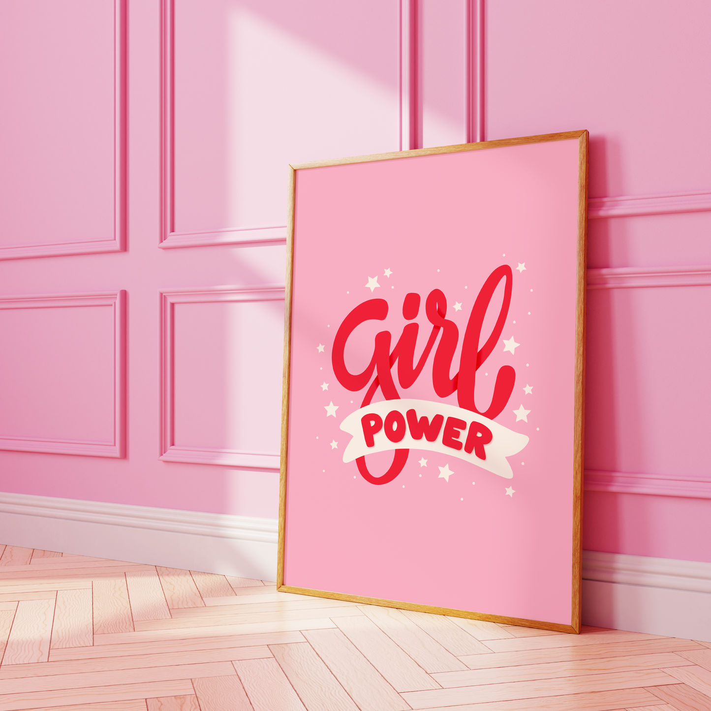 A pink print with red lettering that reads 'Girl power', decorated with little white stars.