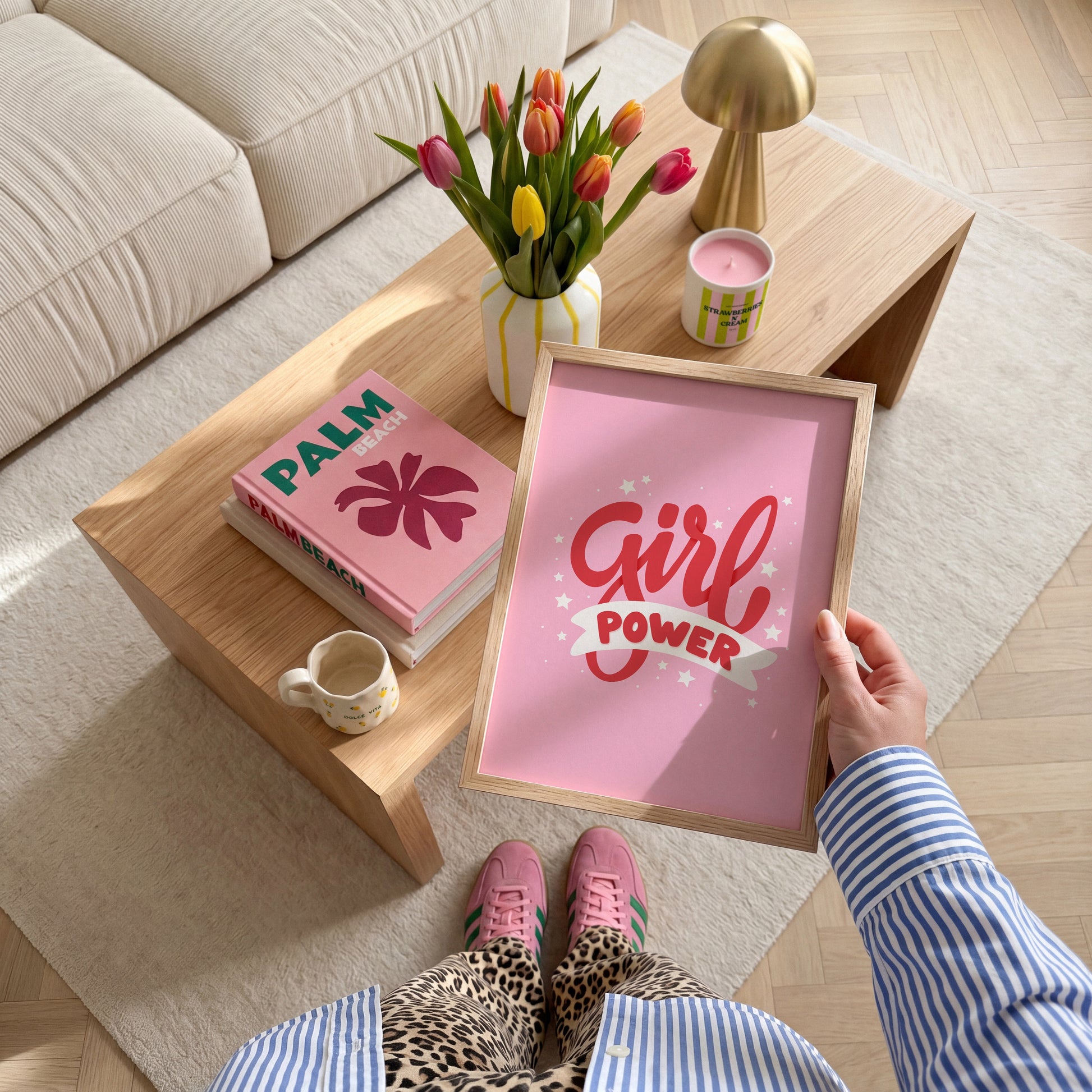 A pink print with red lettering that reads 'Girl power', decorated with little white stars.