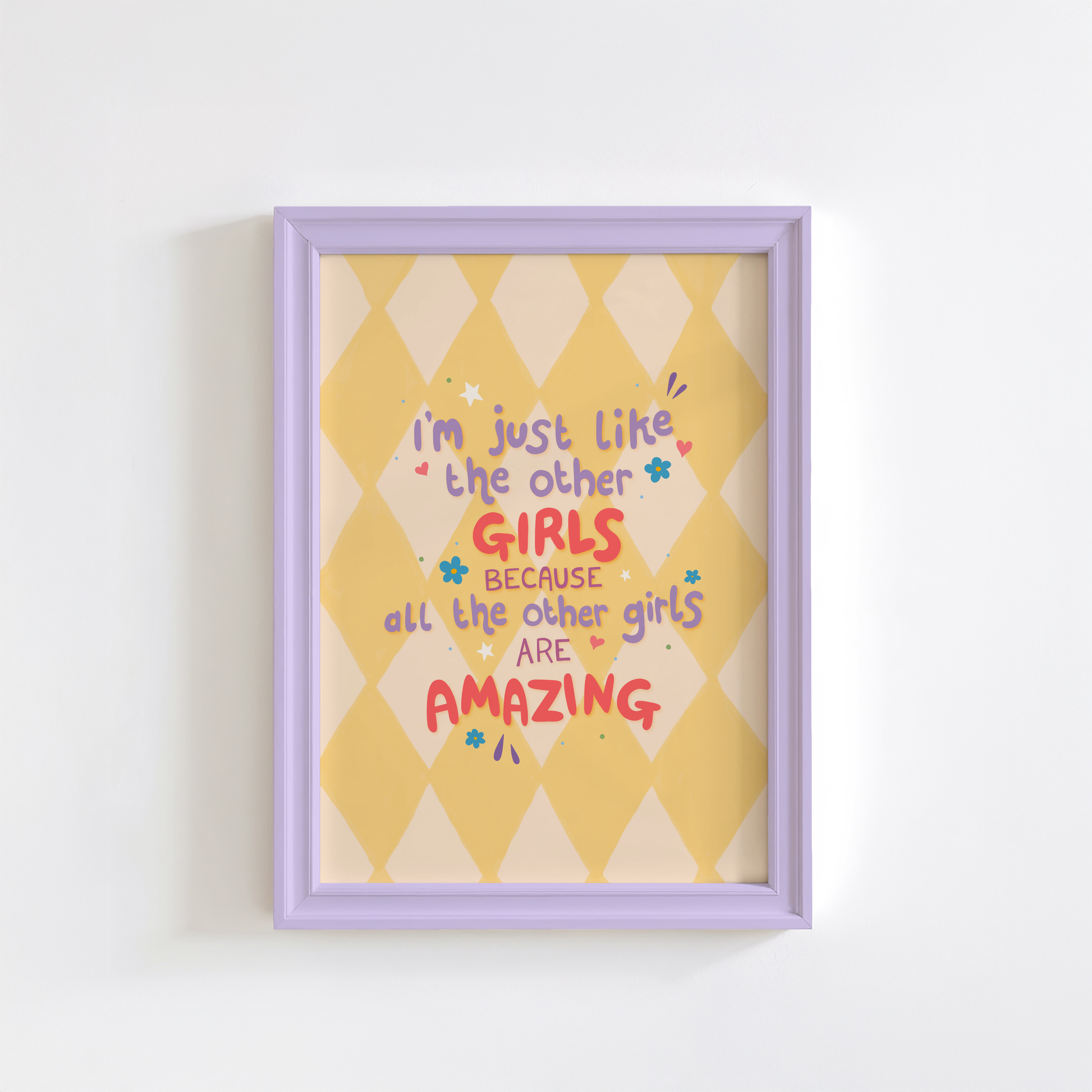 A yellow harlequin patterned background with a female empowerment quote print in different coloured hand lettered text.