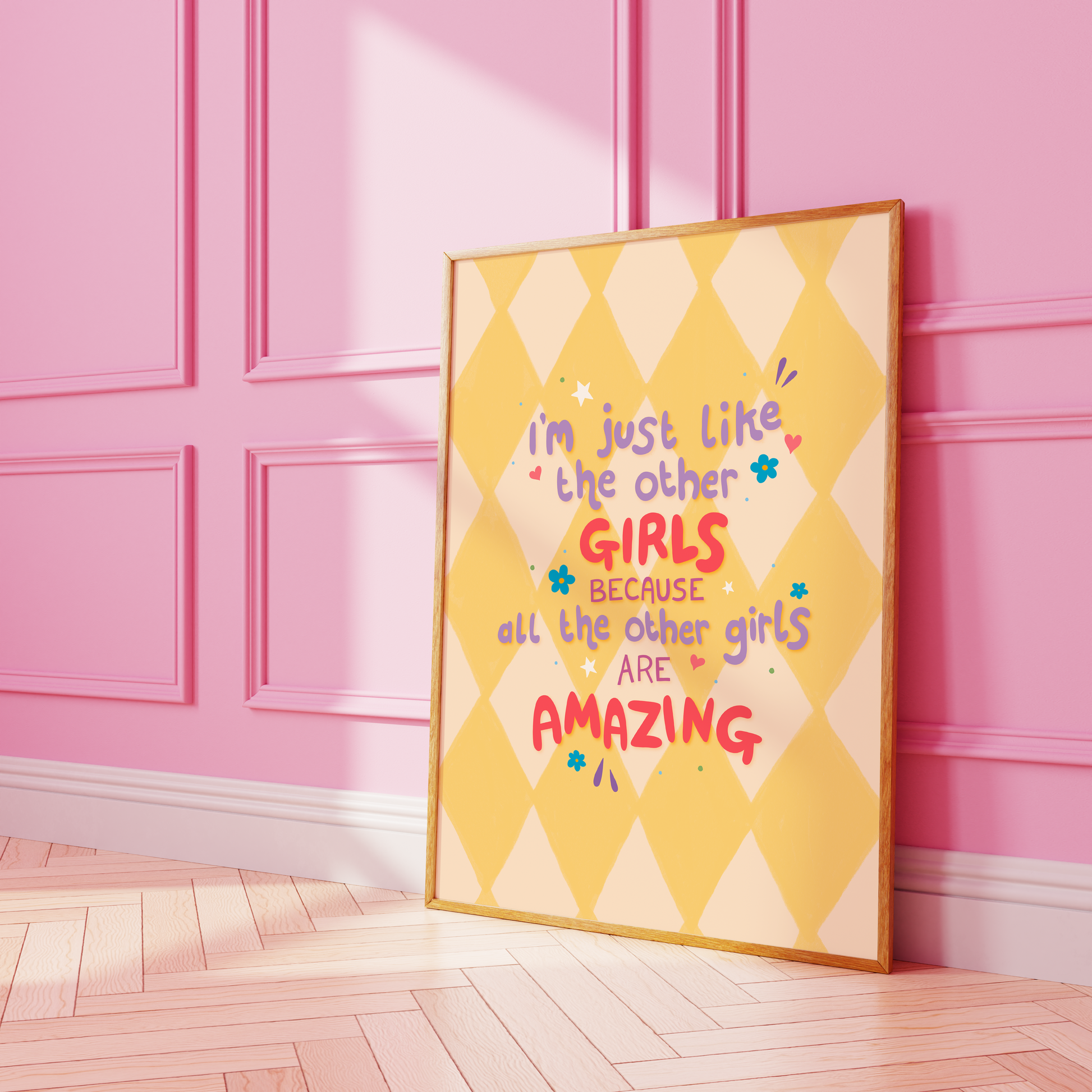 A yellow harlequin patterned background with a female empowerment quote print in different coloured hand lettered text.