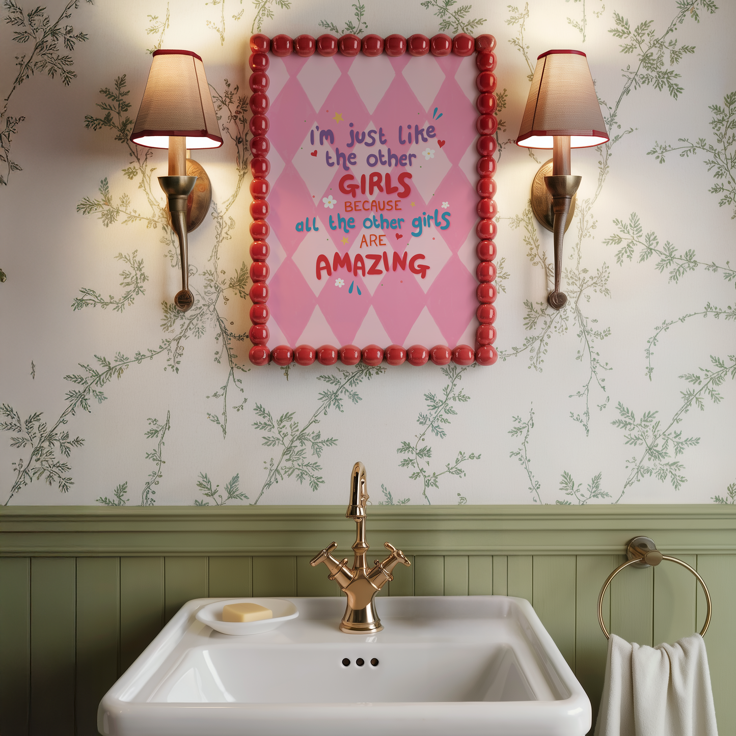 A pink harlequin patterned background with a female empowerment quote print in different coloured hand lettered text.