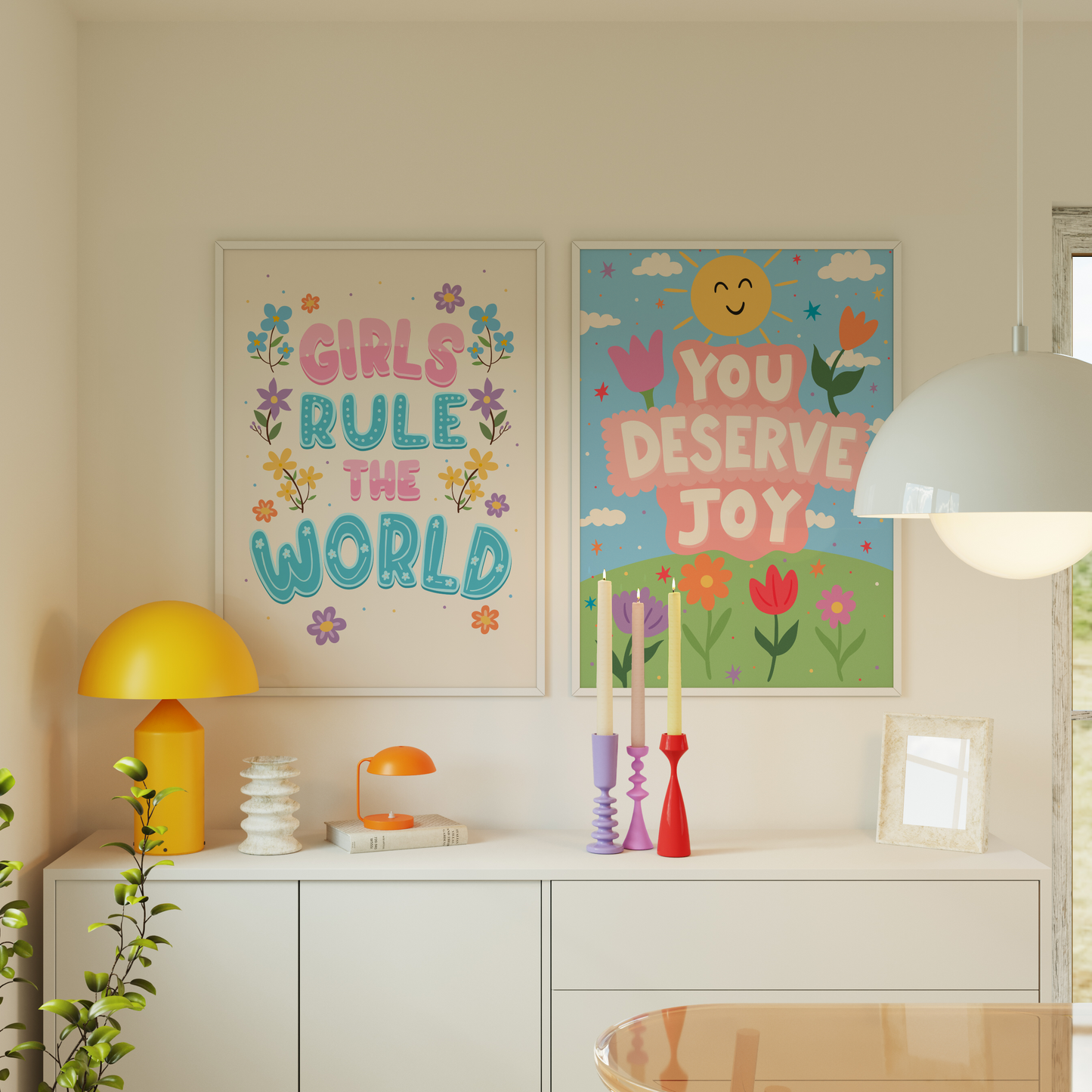 Two colourful wall art prints shown in frames.
