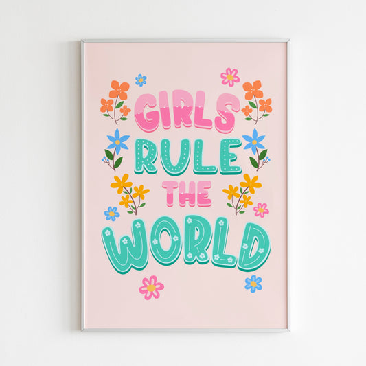 A bright vibrant print saying 'Girls Rule The World' in pink and teal, with flowers illustrated around the sides.