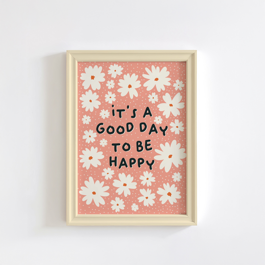 Several off-white daisies, and the words 'it's a good day to be happy' in black, all on a soft orange background print.