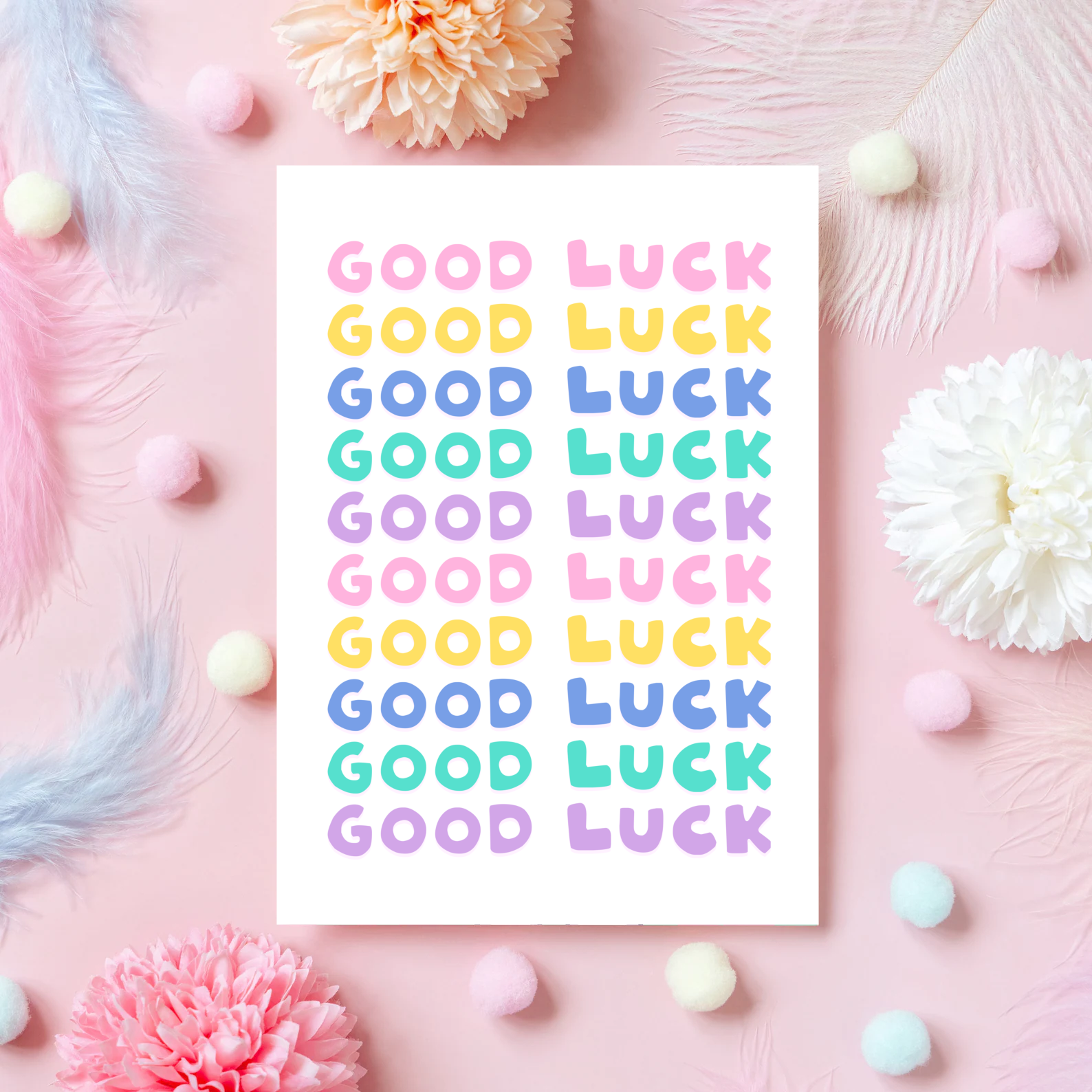 A greetings card, with the phrase 'good luck' repeated several times in colourful shades.