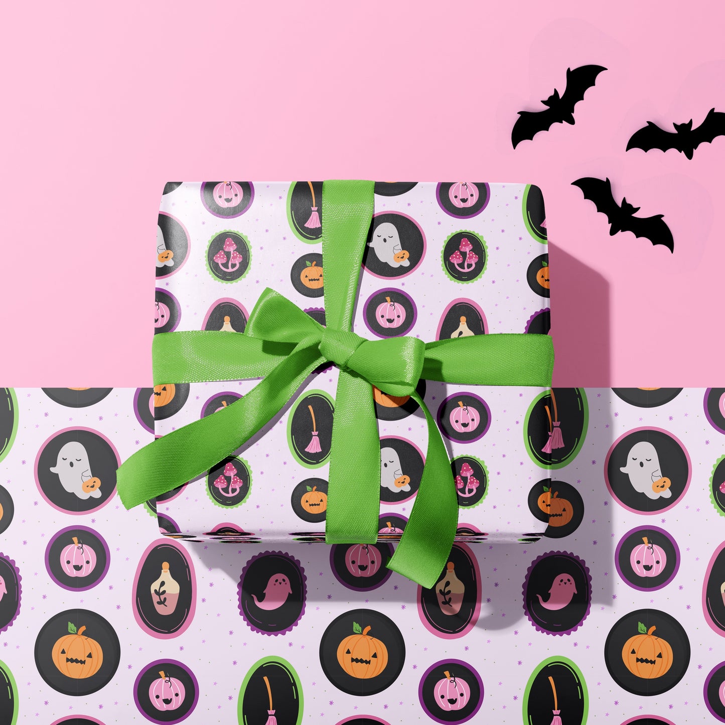 A gift wrapped present, wrapped up in a cute spooky halloween print gift wrap from The Happy Badger.