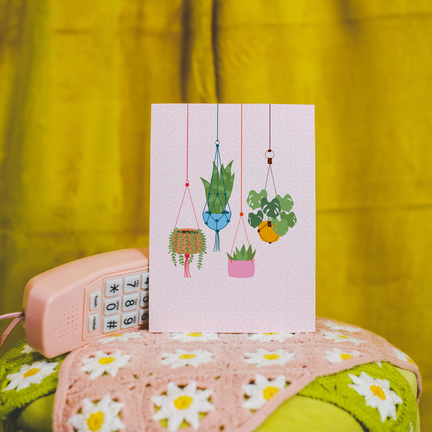 An illustration print featuring four different plats hanging from the top of the print in colourful baskets.