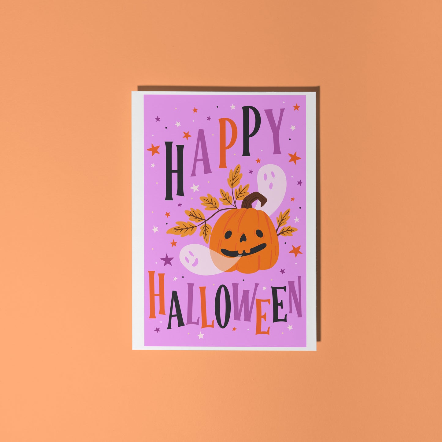 Halloween-themed card with a purple background, orange pumpkin, and colorful text on an orange background.