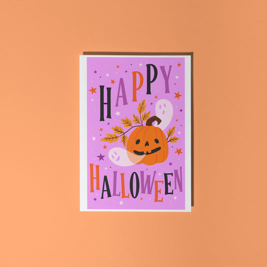 Halloween-themed card with a purple background, orange pumpkin, and colorful text on an orange background.