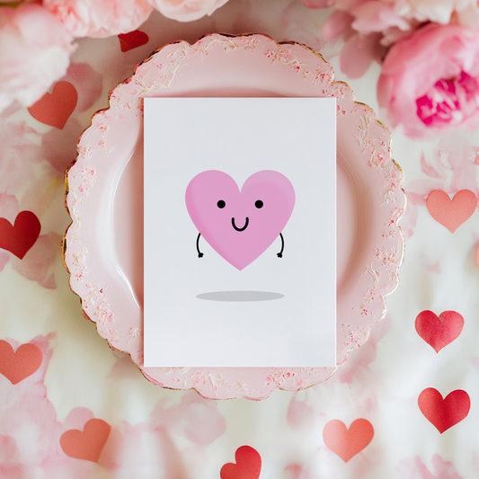 A love themed card with a pink heart, with a smiling face on.