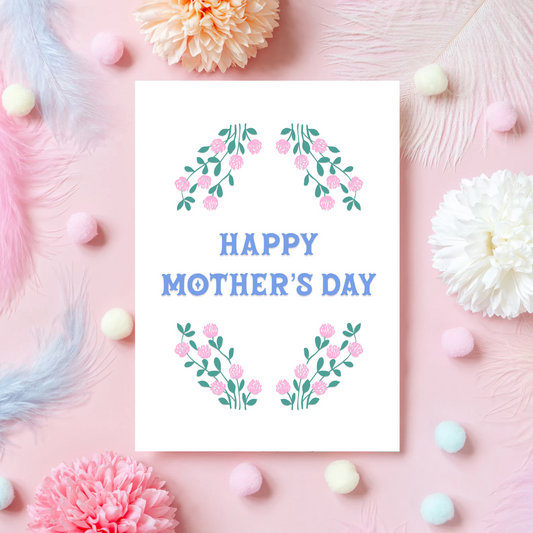 A Mother's Day card, with a pink and green floral border and the words 'Happy Mother's Day' written in the centre in blue.