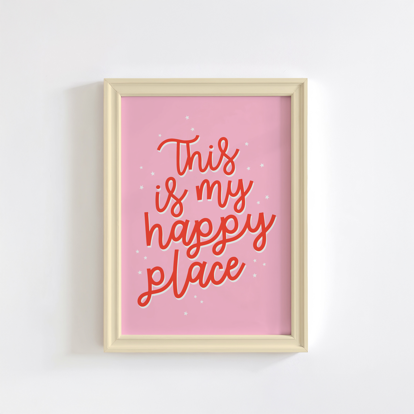 A bright pink print showing fun quote in red text saying this is my happy place.