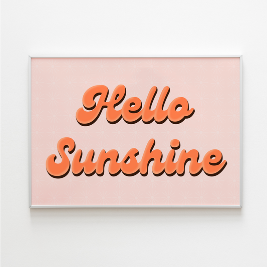 A cute quote print, with orange text saying 'Hello Sunshine' on a pale pink background.