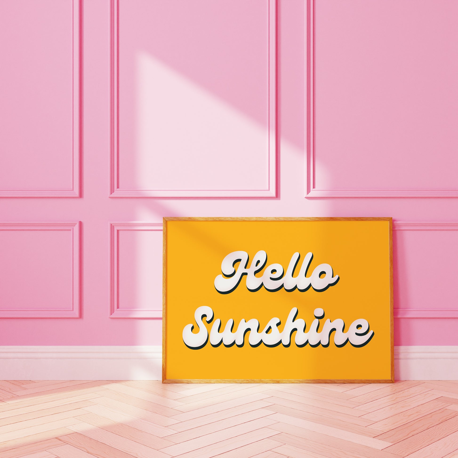 A bright yellow print with white script font saying Hello Sunshine.