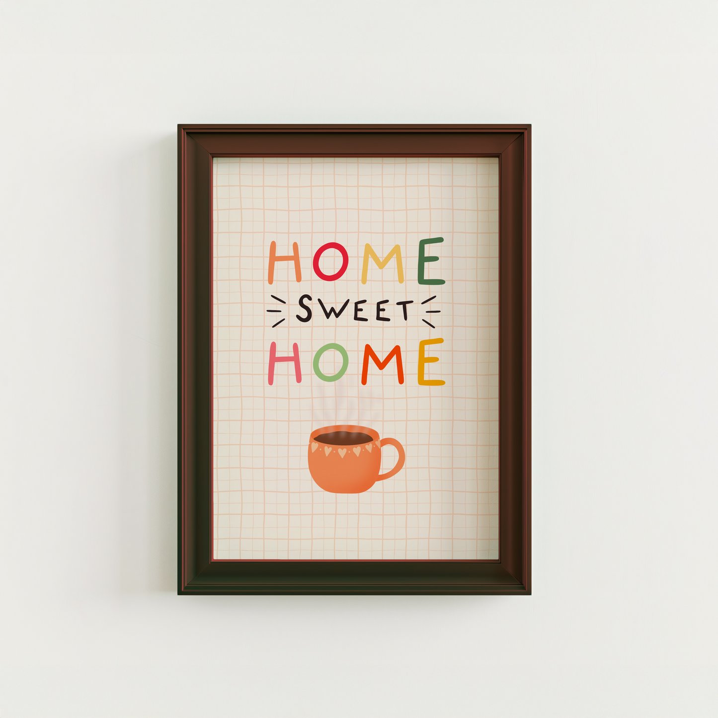 A cosy quote print that reads 'home sweet home' with an orange mug of coffee underneath. The background of the print is cream with a soft orange checkered pattern.