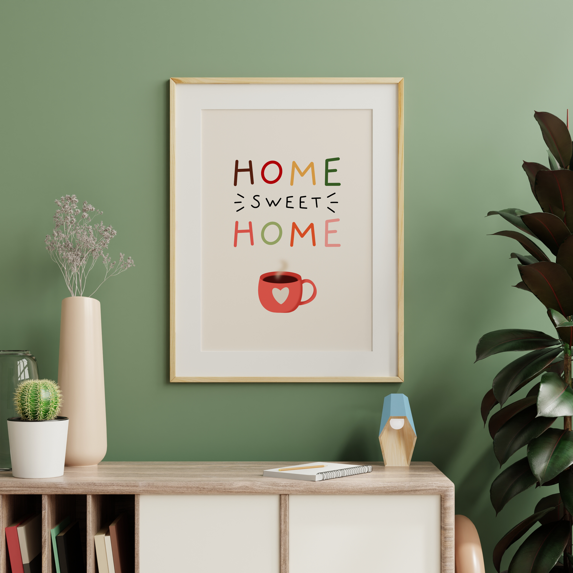 A warm toned print, with the words 'home sweet home' in autumnal colours with a mug illustration at the bottom.