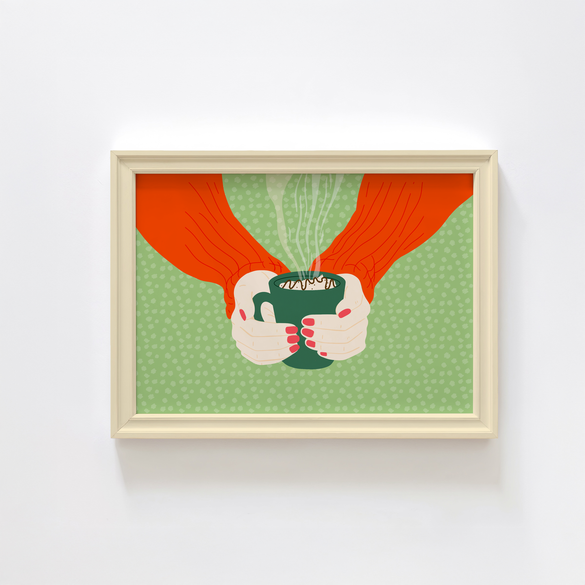 A green spotty print with an illustration of two hands holding a green mug with hot chocolate in.