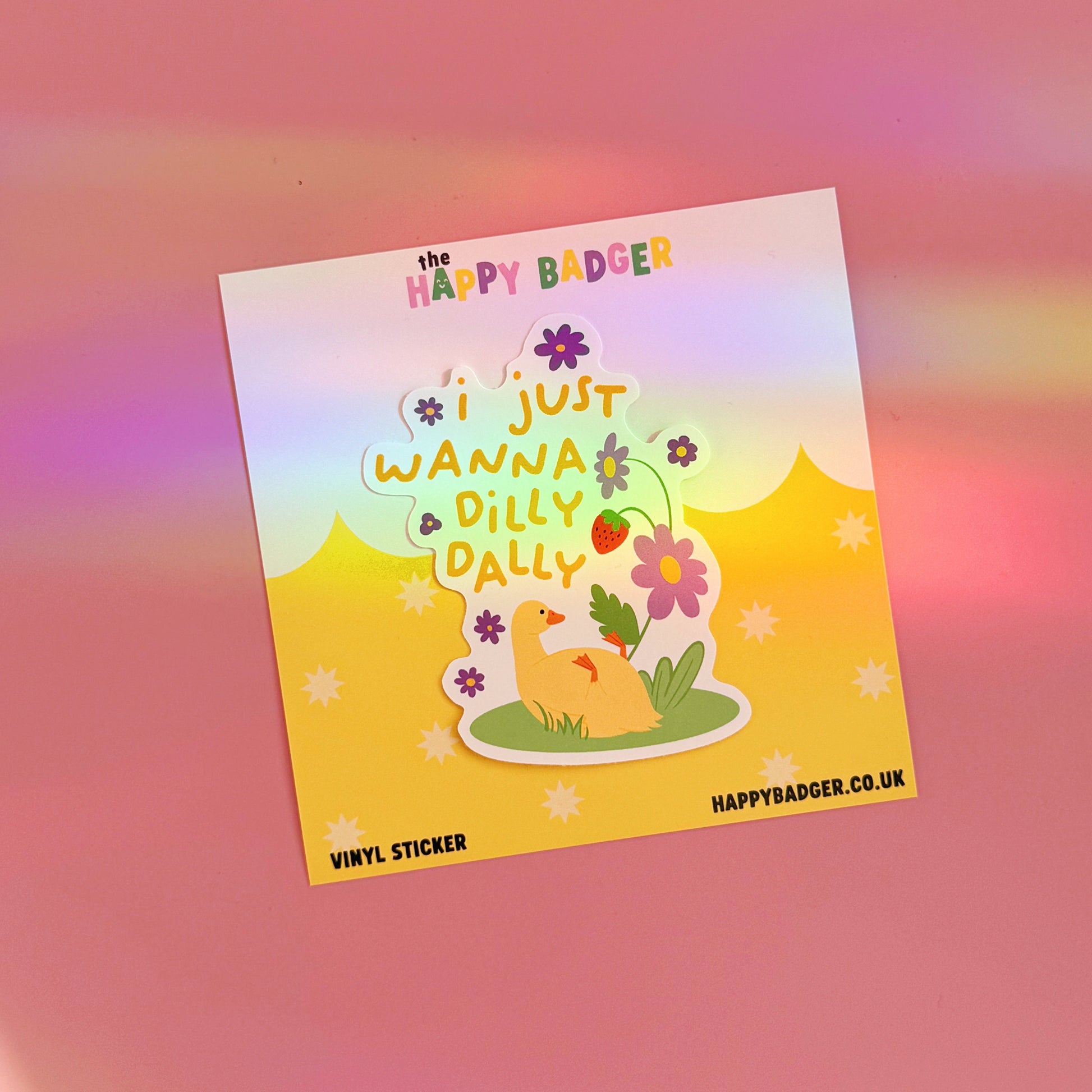 A waterproof vinyl sticker with a duck lazing amongst flowers, with text that reads 'I just wanna dilly dally'.