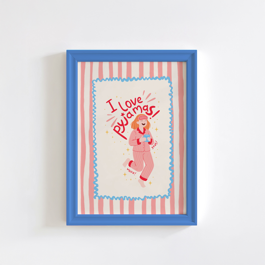 Framed artwork with a cartoon character and 'I love pajamas' text on a striped background.