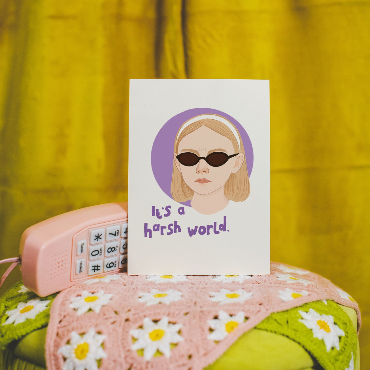 An illustrated portrait of Ray from the film 'Uptown Girls' with her quote that reads 'it's a harsh world.'.