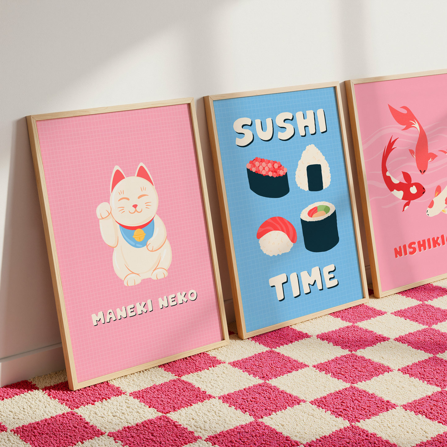 A set of three colourful wall art prints inspired by Japanese culture, featuring a Lucky Cat, Sushi and Japanese Fish.