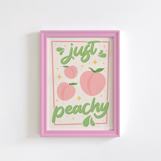 An art print with the text 'just peachy' hand-lettered in teal script, accompanied by illustrations of pink peaches and leaves, and a soft pink border.