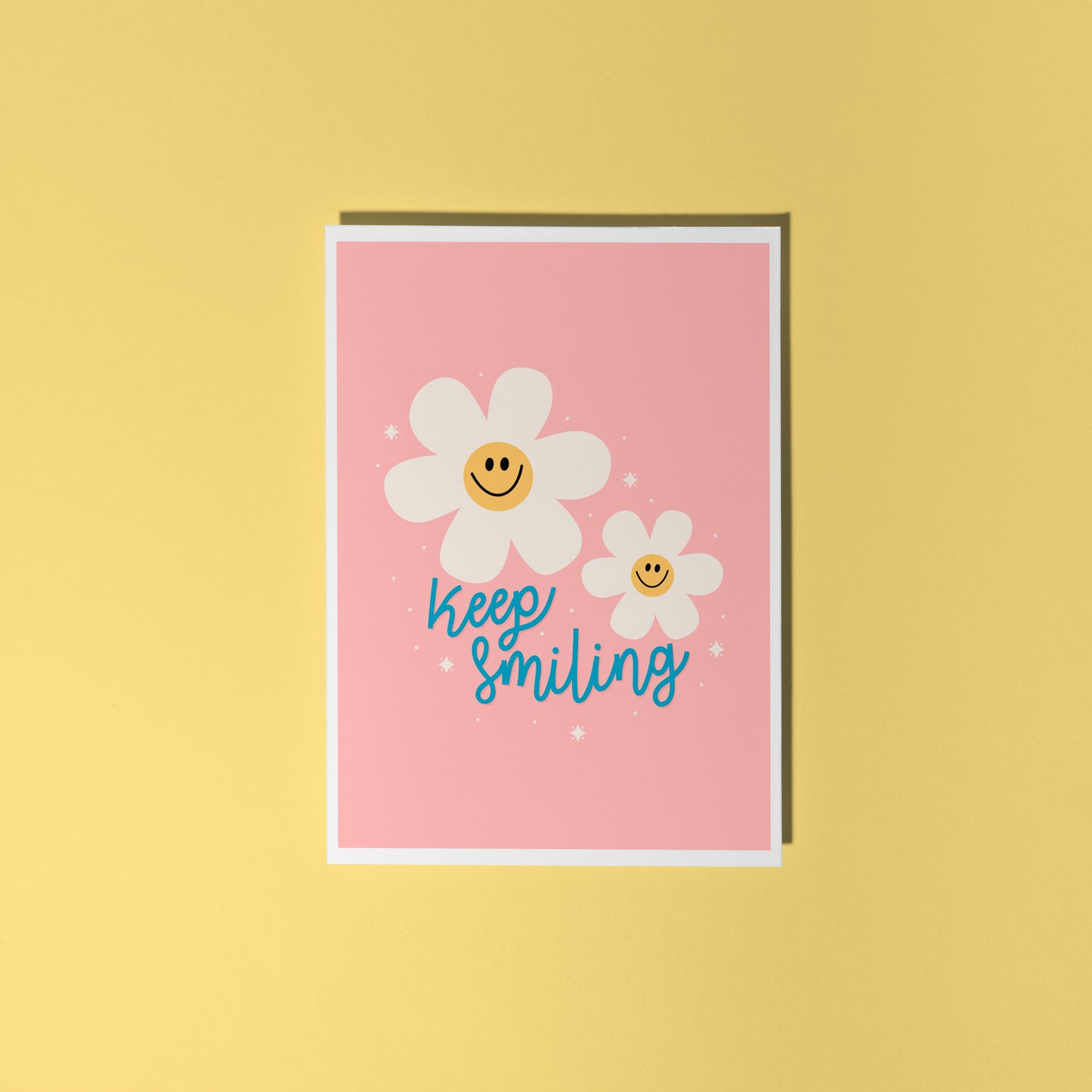 Card with smiley flowers and 'Keep smiling' text on a pink background