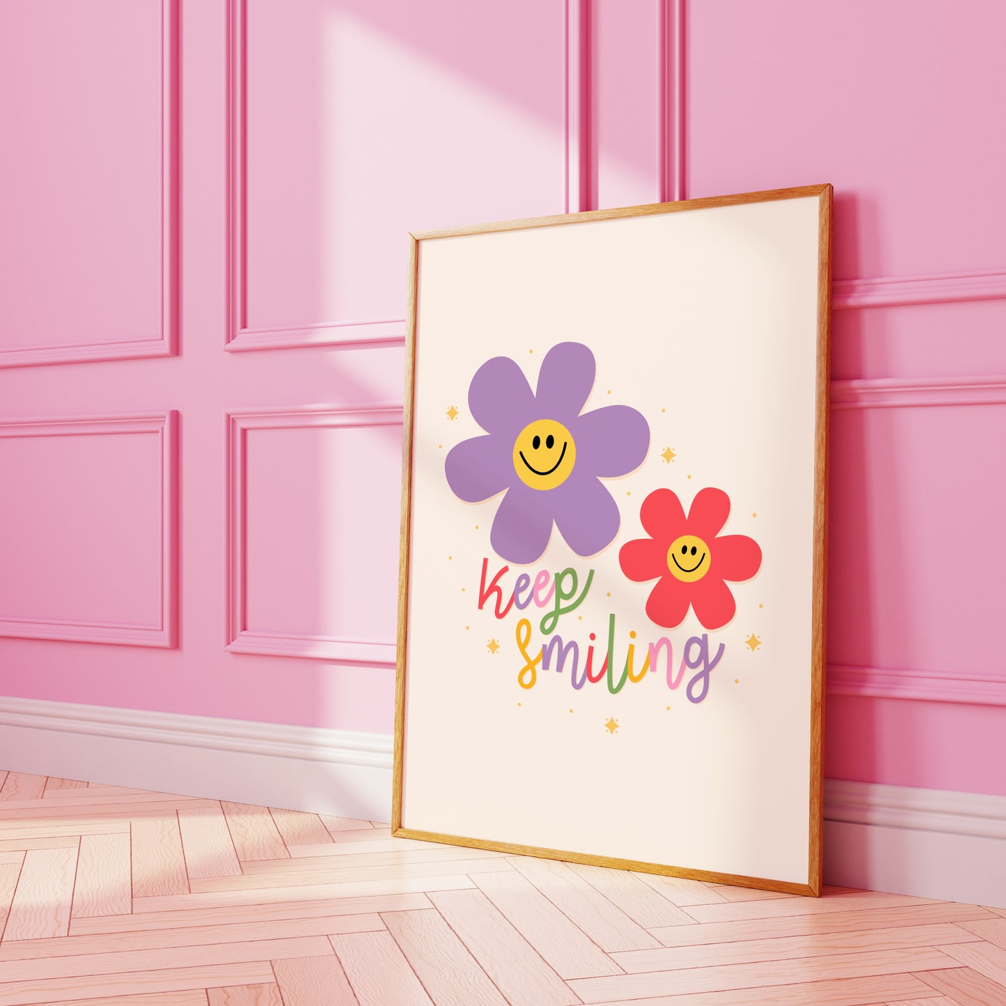 A positive quote print with two smiling daisies in purple and red.