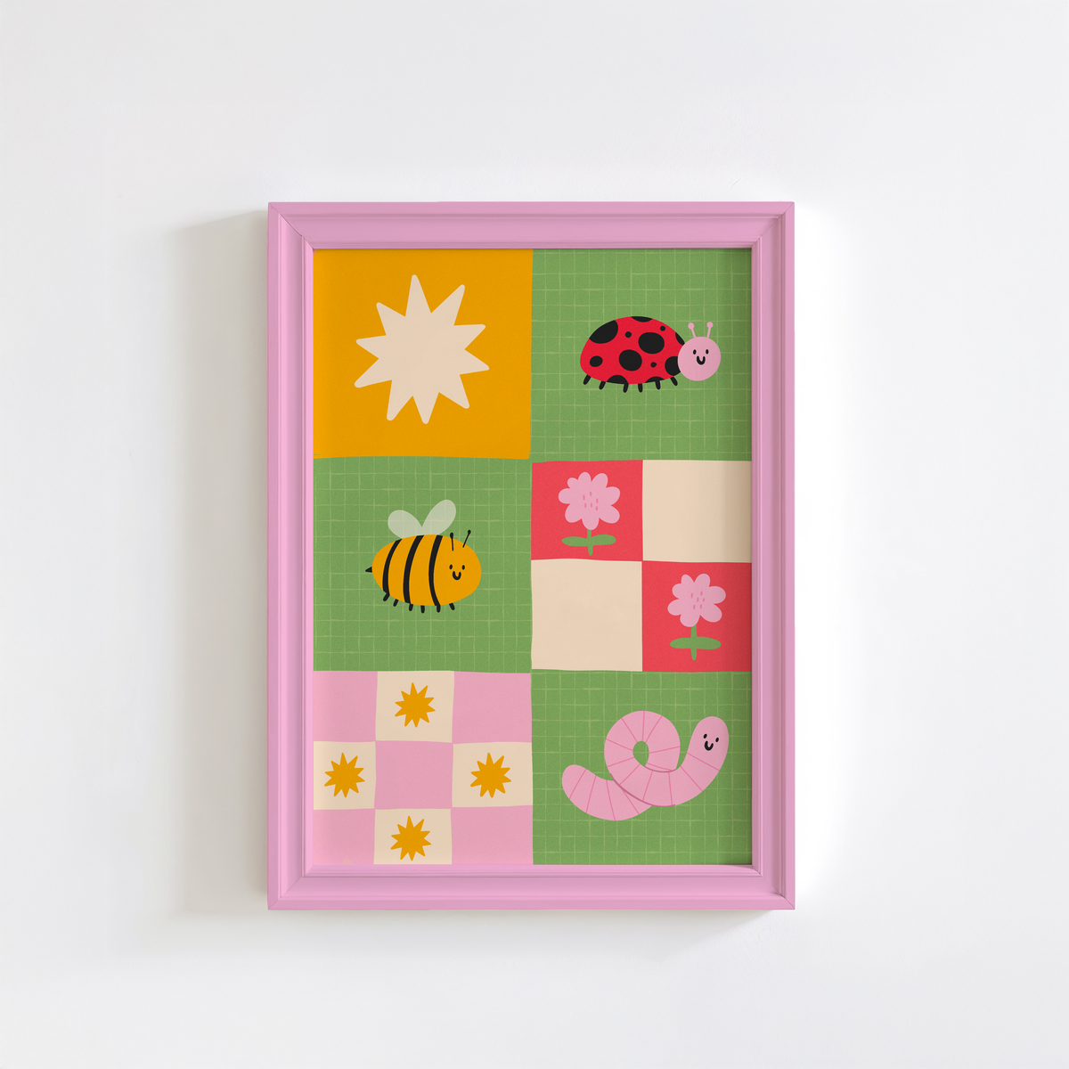 A framed children's art print. The illustration features colourful cartoon motifs including a ladybug, bee, worm, flowers, and suns on green, pink, yellow, and cream squares.