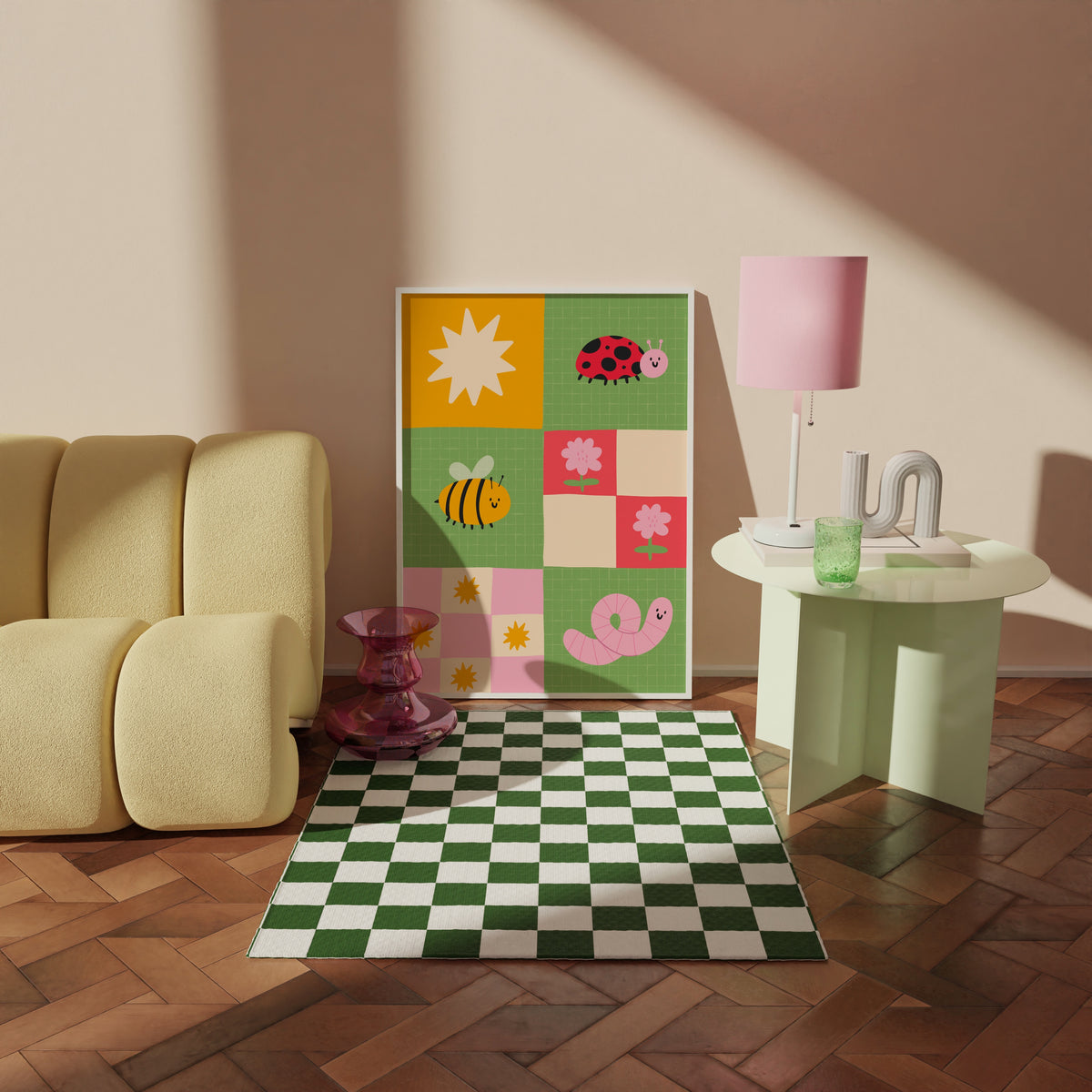 A framed children's art print. The illustration features colourful cartoon motifs including a ladybug, bee, worm, flowers, and suns on green, pink, yellow, and cream squares.