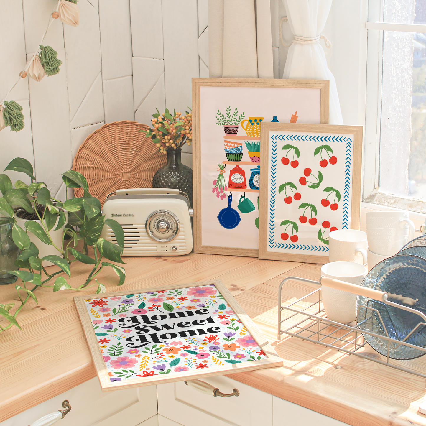 A selection of three prints, in a colourful kitchen setting.