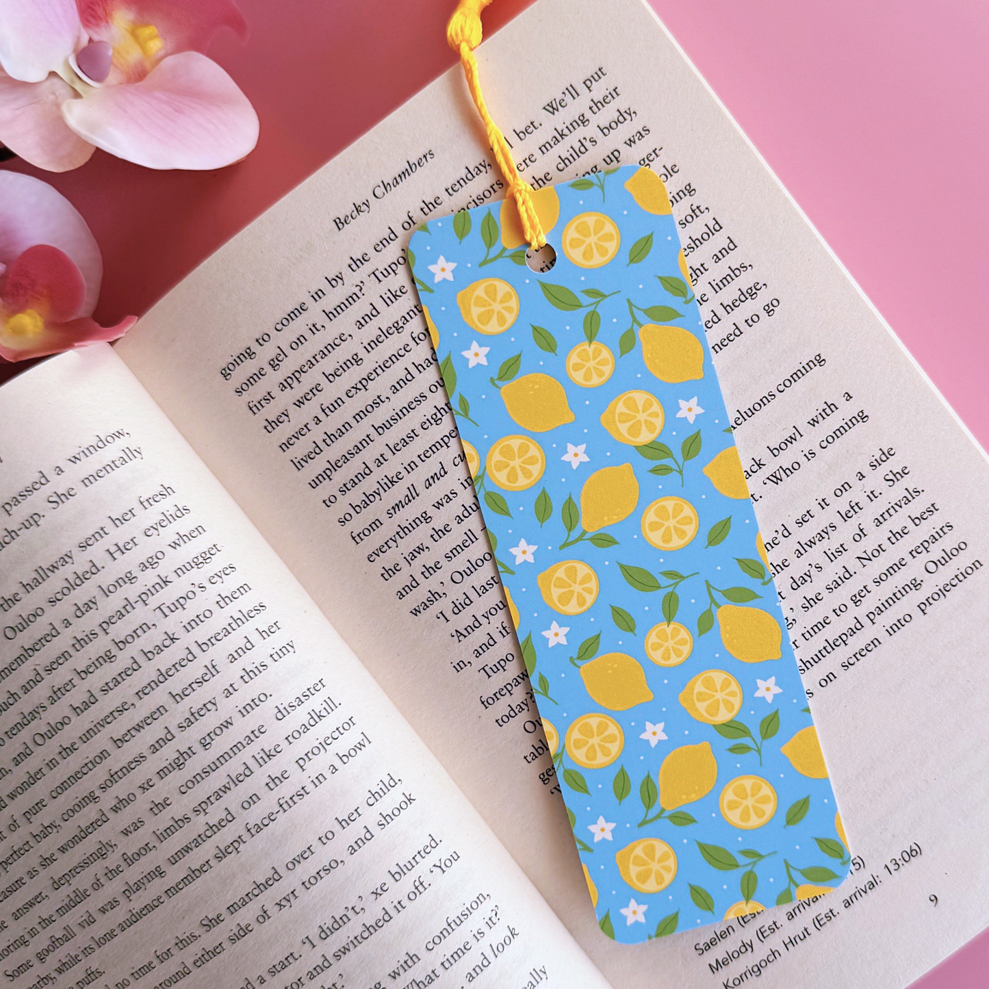 A blue bookmark with a yellow lemon pattern, and a coordinating yellow tassel.
